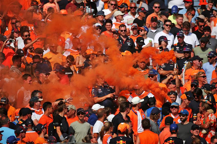 Fans with orange smoke
